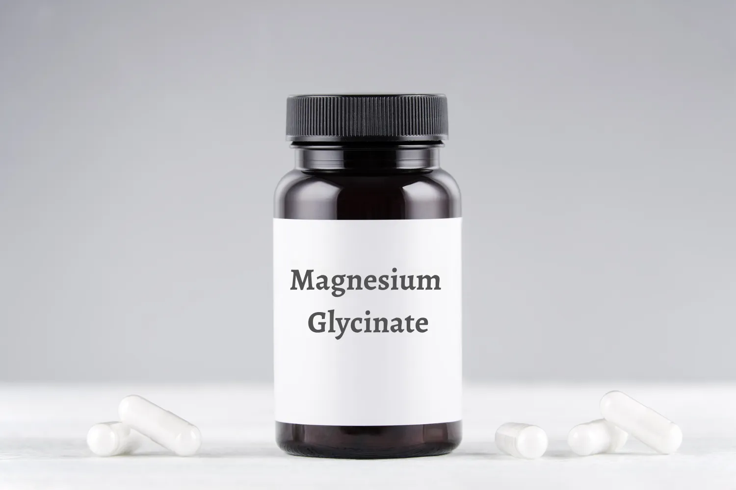 Magnesium glycinate supplement bottle with capsules