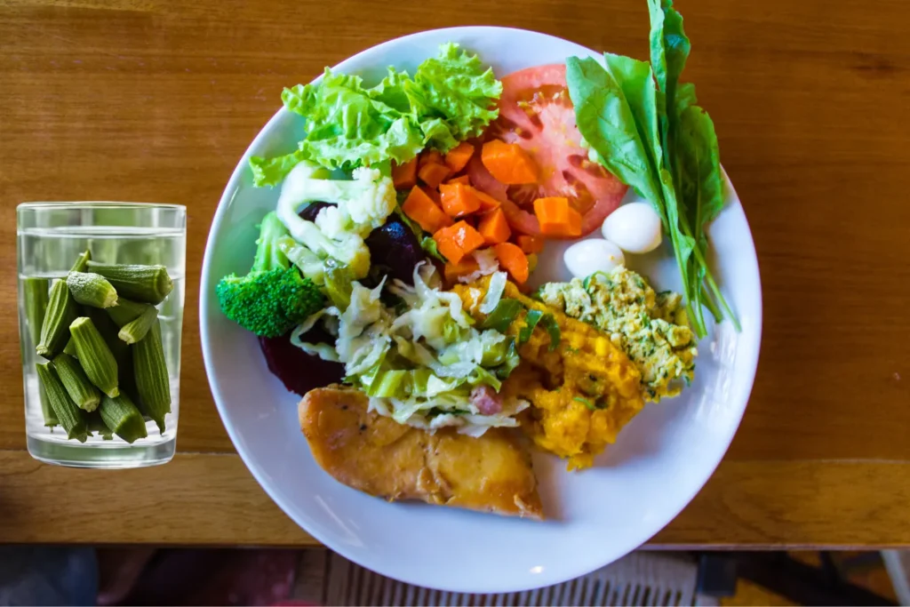 A healthy meal alongside a refreshing glass of okra-infused water.